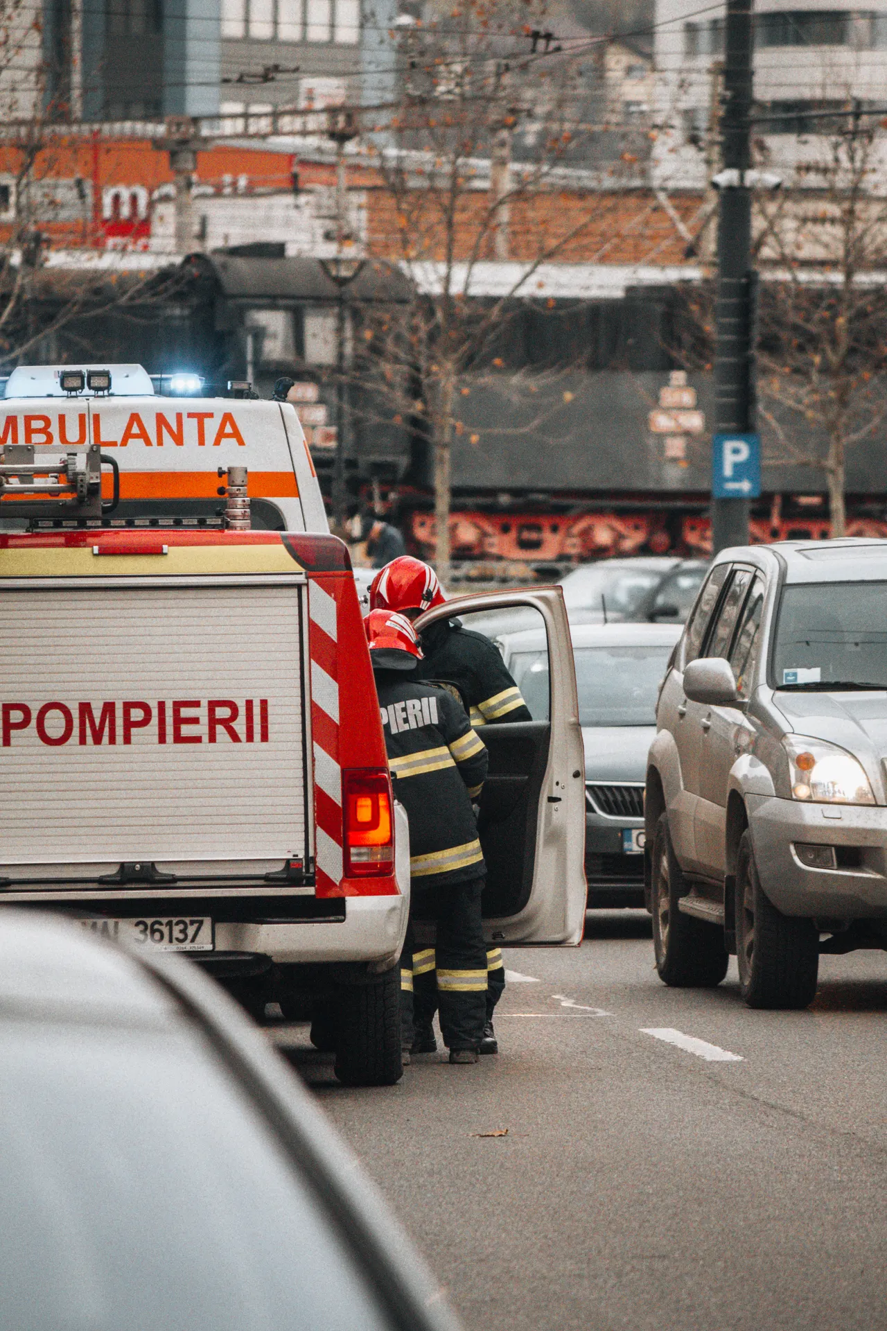 Emergency communication — firefighters responding on an urban street